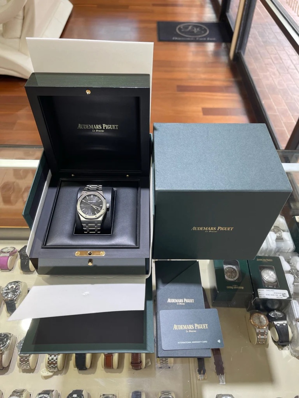 Audemars Piguet Silver Watch with Black Dial and Stainless Bracelet